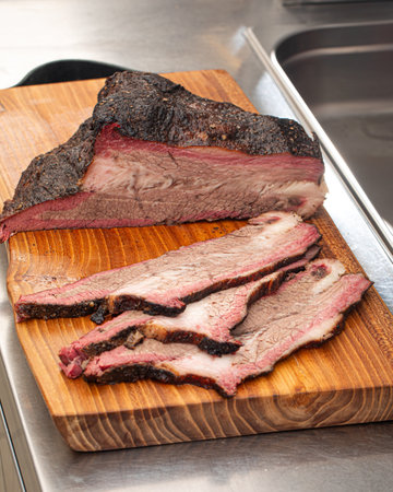 Sliced american beef brisket on a wooden boardの写真素材