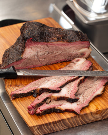 Sliced american beef brisket on a wooden boardの写真素材