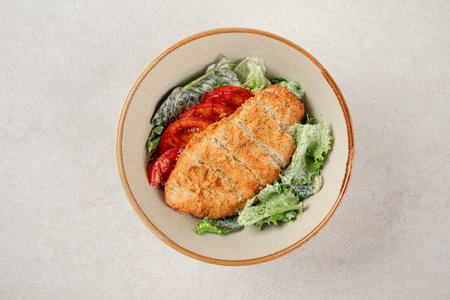 Portion of chicken schnitzel with vegetablesの写真素材