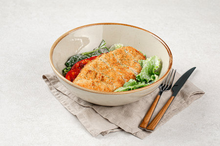 Portion of chicken schnitzel with vegetablesの写真素材
