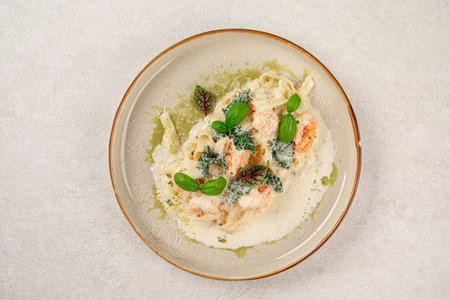 Portion of fettuccine with shrimps in cream sauceの写真素材