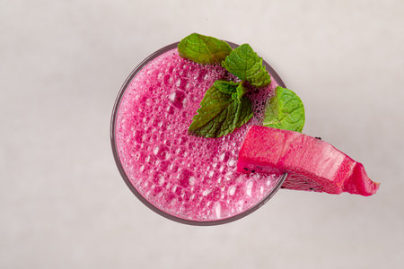 Glass of dragon fruit pitahaya smoothie with mintの写真素材