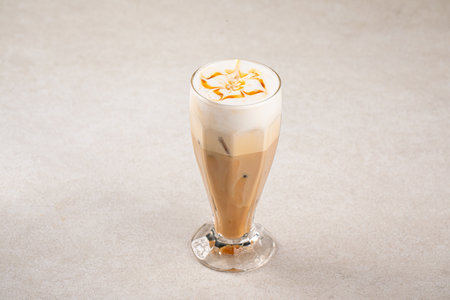 Portion of coffee latte with caramel syrupの写真素材