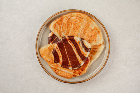 Plate of assorted fresh flat croissantsの写真素材