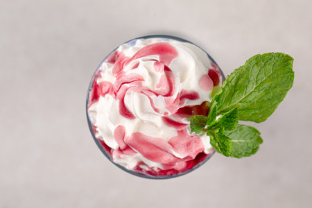 Portion of blueberry milkshake with whipped creamの写真素材