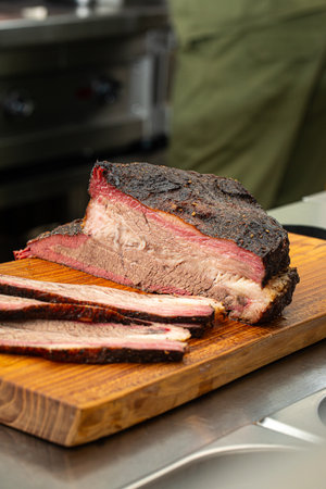 Sliced american beef brisket on a wooden boardの写真素材