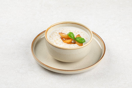 Portion of breakfast porridge cereals with peachの写真素材