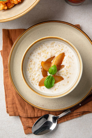 Portion of breakfast porridge cereals with peachの写真素材