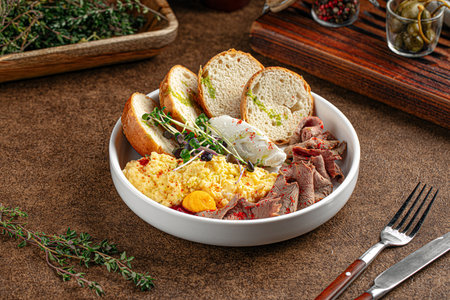 Portion of with scrambled eggs and pastramiの写真素材