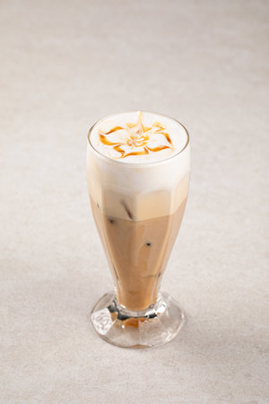 Portion of coffee latte with caramel syrupの写真素材