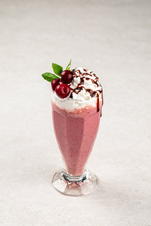 Glass of sweet fresh cherry milkshakeの写真素材
