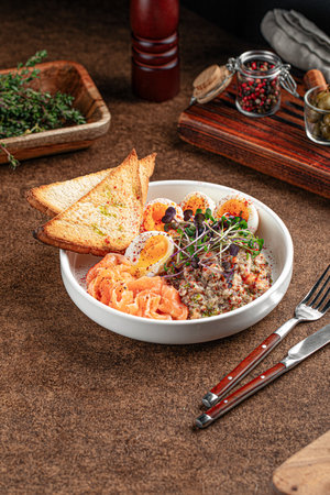 Portion o breakfast with salmon and eggsの写真素材