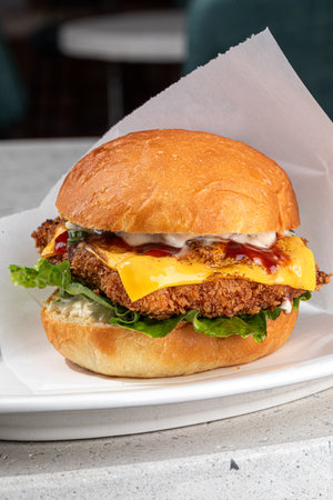 Portion of appetizing fried chicken burgerの写真素材
