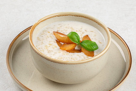Portion of breakfast porridge cereals with peachの写真素材