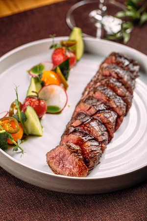 Grilled sliced beef steak with vegetableの写真素材