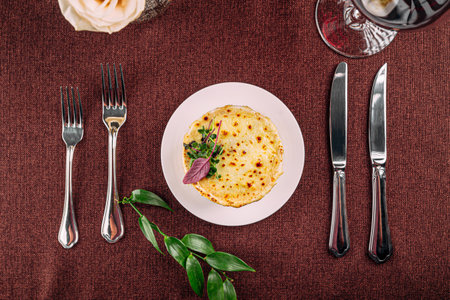 Baked julienne dish served on restaurant tableの写真素材