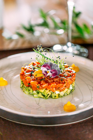 Portion of layered salad with salmonの写真素材