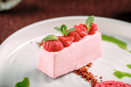 Portion of pink raspberry mousse dessertの写真素材
