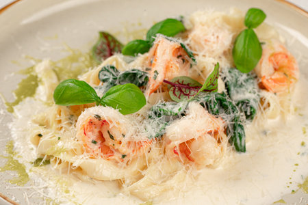 Portion of fettuccine with shrimps in cream sauceの写真素材