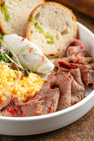 Portion of with scrambled eggs and pastramiの写真素材