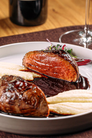 Portion of grilled beef steak with mashed potatoの写真素材