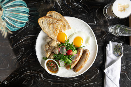 Breakfast with sausages and fried eggsの写真素材