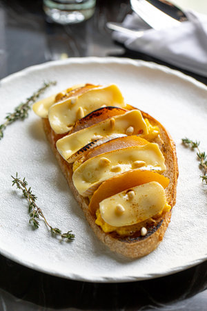 Toast with scrambled egg pear and brieの写真素材
