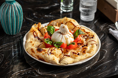 Portion of italian style focaccia with burattaの写真素材