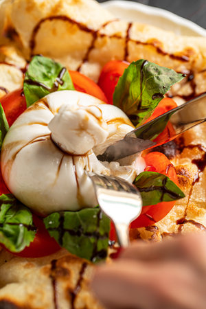 Portion of italian style focaccia with burattaの写真素材