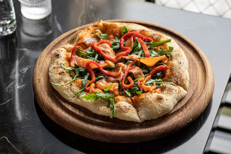 Portion of pizza with baked pepperの写真素材