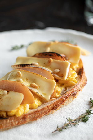 Toast with scrambled egg pear and brie