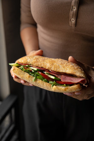 Ciabatta sandwich with meat and saladの写真素材