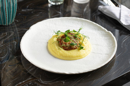 Portion of gourmet cutlets with mashed potatoの写真素材
