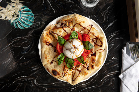 Portion of italian style focaccia with burattaの写真素材