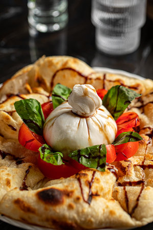 Portion of italian style focaccia with buratta