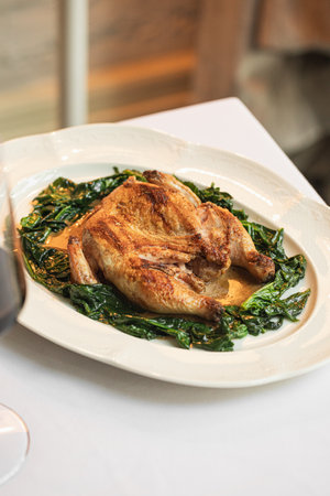 Portion of baked chicken with spinachの写真素材