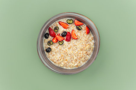 Sweet breakfast oatmeal porridge with berriesの写真素材