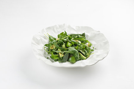 Portion of green salad with avocadoの写真素材
