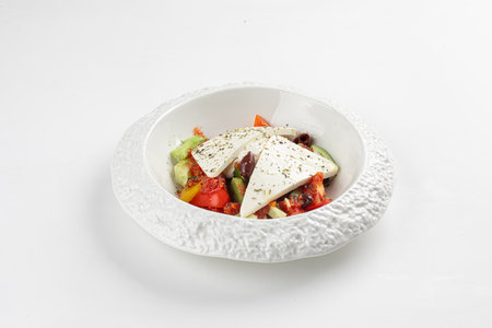 Portion of greek salad with vegetablesの写真素材