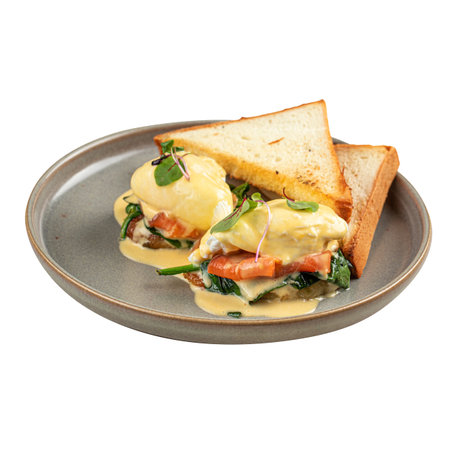 Portion of eggs benedict with bread and salmonの写真素材