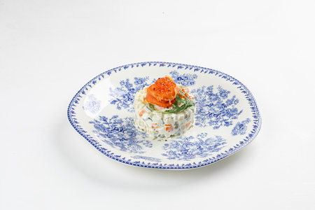Portion of gourmet olivier salad with salmonの写真素材
