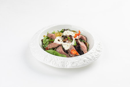 Roast beef salad with stracciatella and tomatoesの写真素材