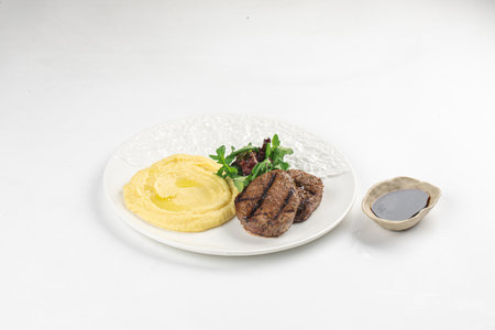Beef mignon medallion with mashed potatoesの写真素材
