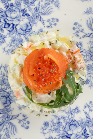 Portion of gourmet olivier salad with salmonの写真素材