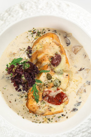 Portion of chicken fillet with mushroom sauceの写真素材