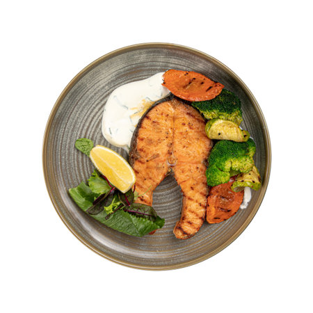 Isolated portion of grilled salmon with vegetablesの写真素材
