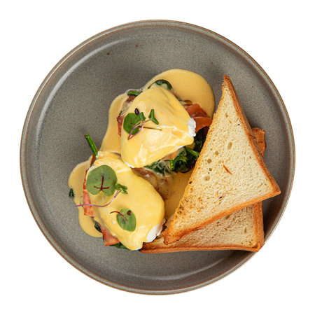 Portion of eggs benedict with bread and salmonの写真素材