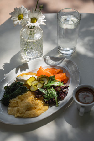 Portion of cafe breakfast with scramble and salmonの写真素材