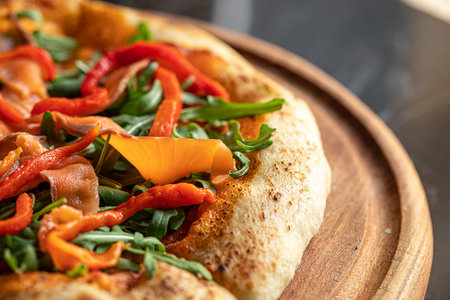Portion of pizza with salmon and baked pepperの写真素材