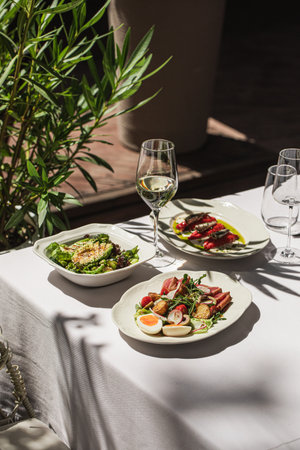 Restaurant terrace table served with appetizersの写真素材